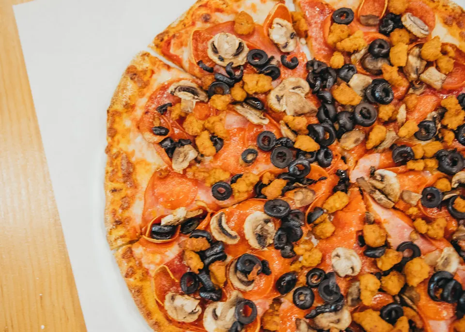 Bulldog pizza: Canadian bacon, Italian sausage, pepperoni, salami, black olives, mushrooms & mozzarella